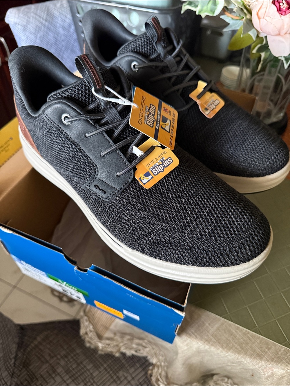 Skechers Men's Black Knit Slip-On Sneakers with White Sole and Brown Heel Accent